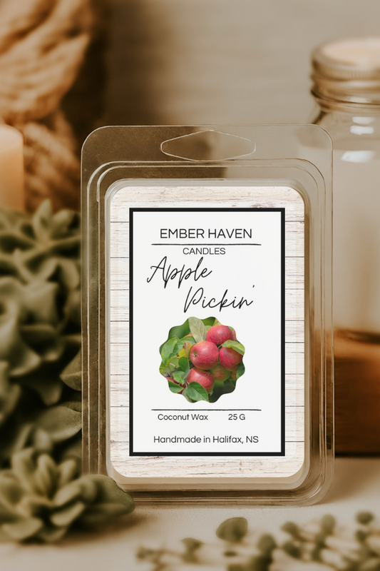 Ember Haven Candles Apple Pickin' wax melt packaging with a candle and jar in the background