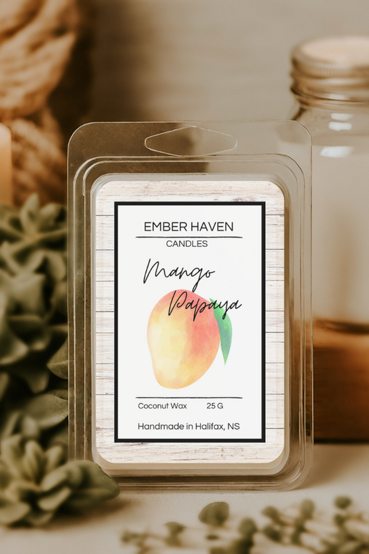 Ember Haven Candles Mango Papaya wax melt packaging with a candle and jar in the background